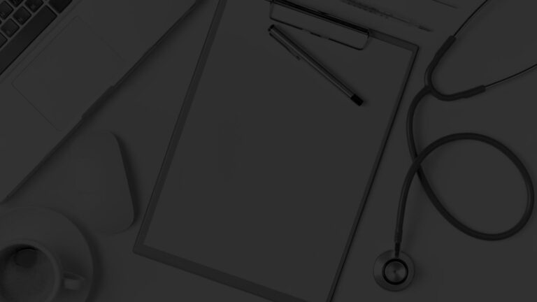clipboard. pens and stethoscope on a desk