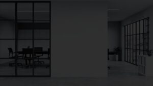 Office boardroom visible through glass walls in a corporate setting