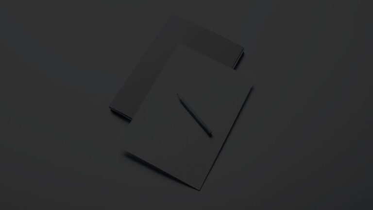 Overhead shot of file folders with a pencil placed on top
