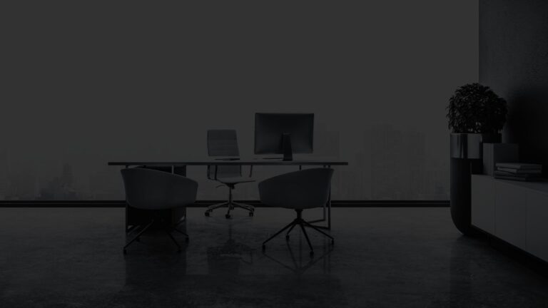 Contemporary office space in front of a large window overlooking a cityscape