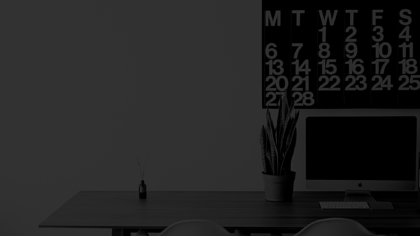 desk with a plant on it