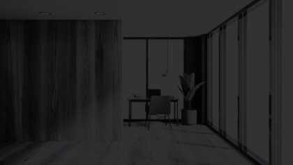 Minimalist office design with large windows and a potted plant