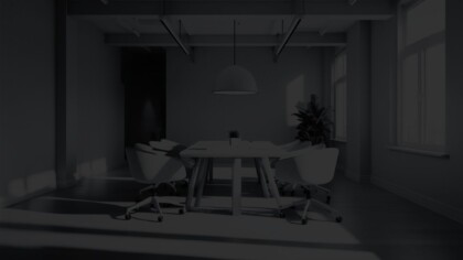 Conference-style office with a large table in the center and six chairs