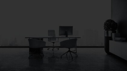 Contemporary office space in front of a large window overlooking a cityscape