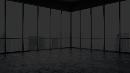 Office corner space with tiled floors and natural light from glass windows