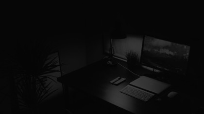 Computer on a desk in the dark