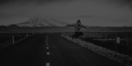 person jumping on an empty road